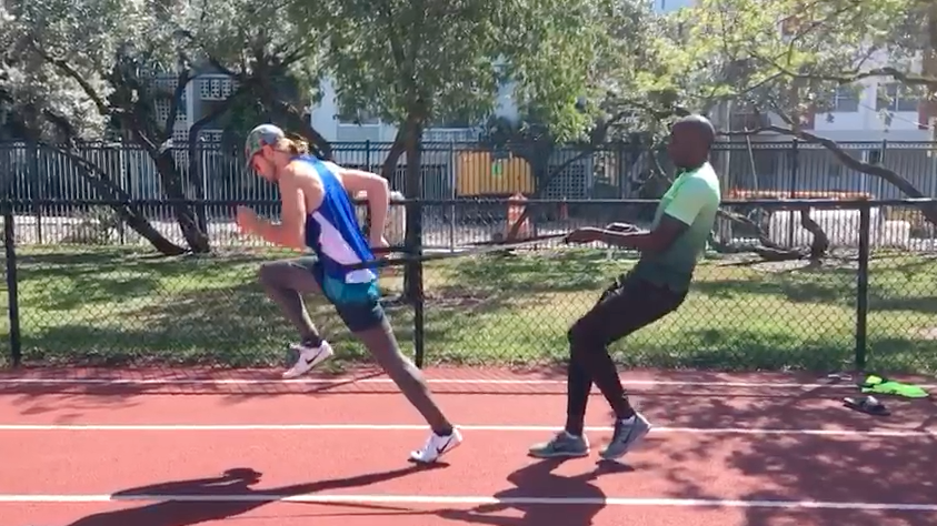 Sprinter runner track and field NFL speed training run faster miami track coach running technique running form